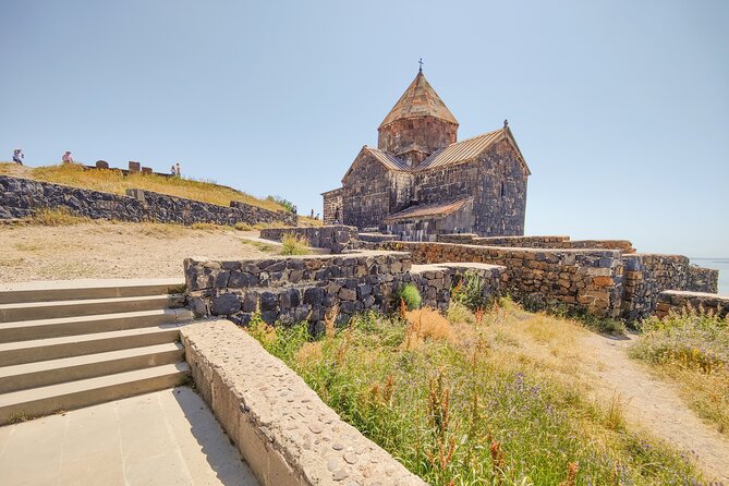 From Yerevan:Sevan, Dilijan, Haghartsin, Goshavank, Lake Parz - Sevanavank Monastery: steps, stone detail, and a dome that recorded Yerevan’s name